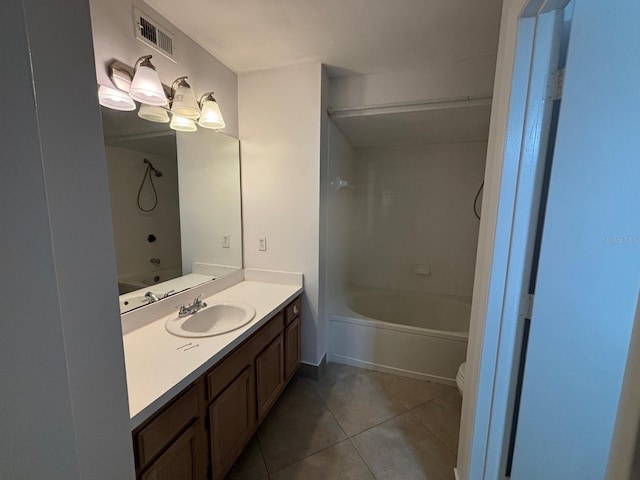 full bathroom with bathtub / shower combination, tile patterned flooring, vanity, and toilet