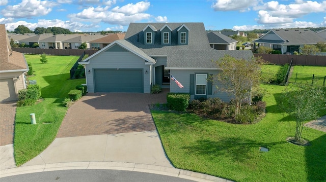 view of front facade featuring a front lawn and a garage