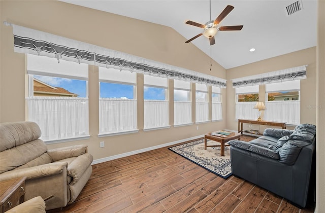 sunroom / solarium with ceiling fan and lofted ceiling