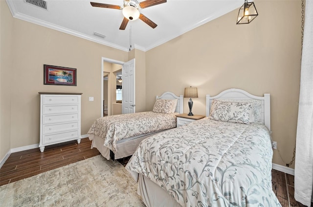 bedroom with wood-type flooring, ceiling fan, and crown molding