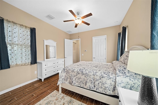 bedroom with ceiling fan and dark hardwood / wood-style floors