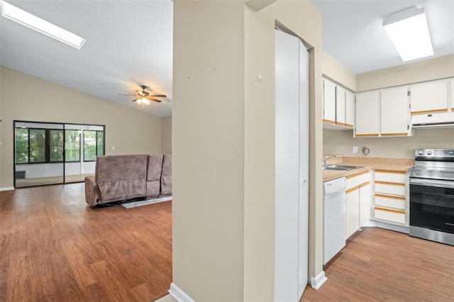 kitchen featuring dishwasher, sink, white cabinetry, stainless steel electric stove, and ceiling fan