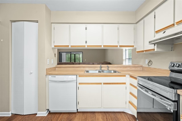 kitchen featuring stainless steel electric stove, white cabinets, white dishwasher, light hardwood / wood-style flooring, and sink