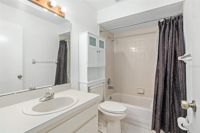 full bathroom with shower / tub combo, vanity, and toilet