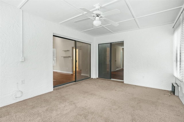 unfurnished bedroom featuring a closet, ceiling fan, and carpet floors