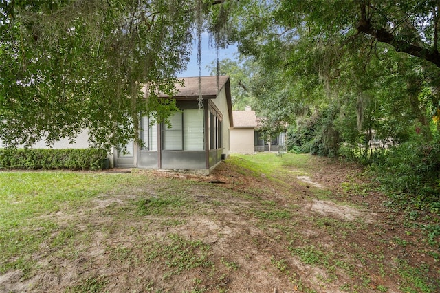 view of yard with a sunroom