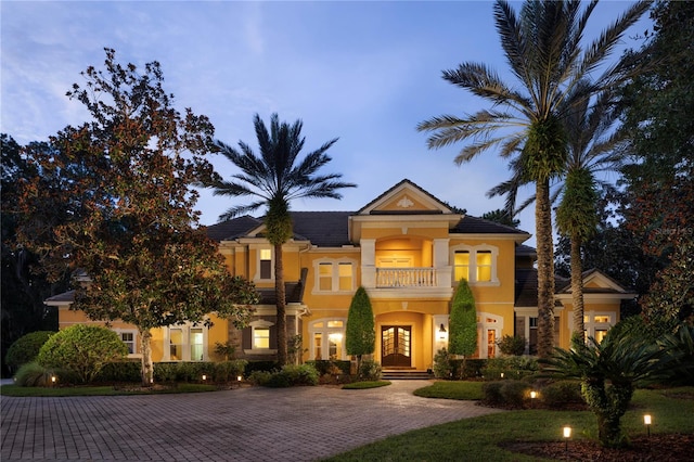 mediterranean / spanish-style home featuring a balcony