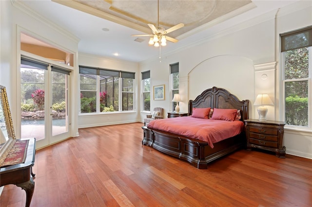 bedroom featuring wood-type flooring, ceiling fan, access to outside, and crown molding