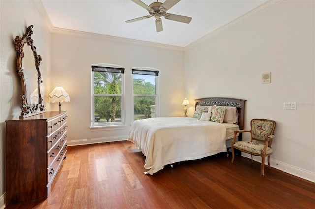 bedroom featuring ceiling fan, ornamental molding, and wood-type flooring