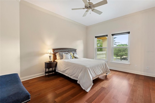 bedroom featuring ornamental molding, ceiling fan, and dark hardwood / wood-style floors