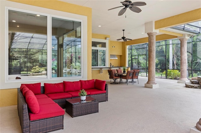 sunroom / solarium featuring decorative columns and ceiling fan