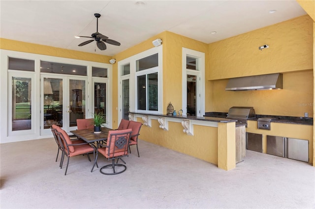 view of patio / terrace with french doors, grilling area, an outdoor kitchen, and ceiling fan