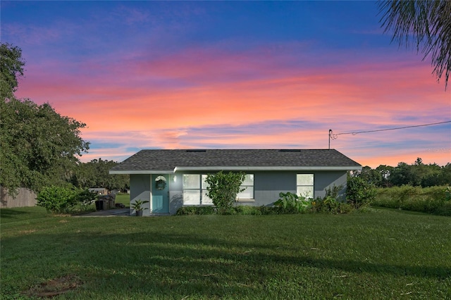 view of front of property with a yard