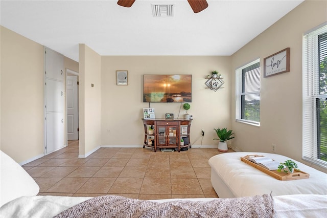 interior space with a wealth of natural light and ceiling fan