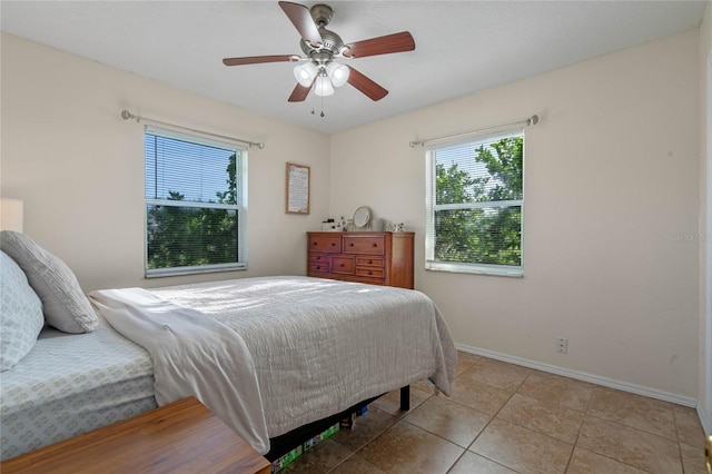 bedroom featuring ceiling fan and light tile patterned floors