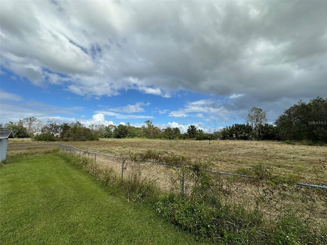 view of yard with a rural view