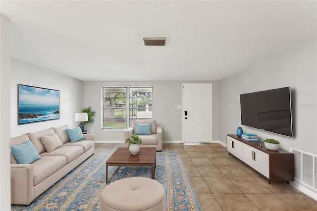 10226 Willow Dr, Port Richey, FL 34668 - living room featuring light tile patterned floors, visible vents, and baseboards