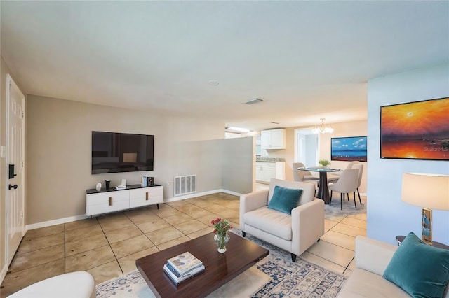 10226 Willow Dr, Port Richey, FL 34668 - living room featuring light tile patterned floors, a notable chandelier, and visible vents