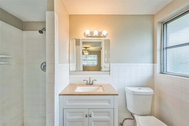 10226 Willow Dr, Port Richey, FL 34668 - full bathroom with toilet, a tile shower, vanity, and a healthy amount of sunlight