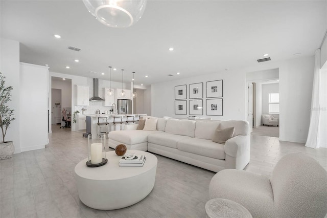 living room with light hardwood / wood-style floors