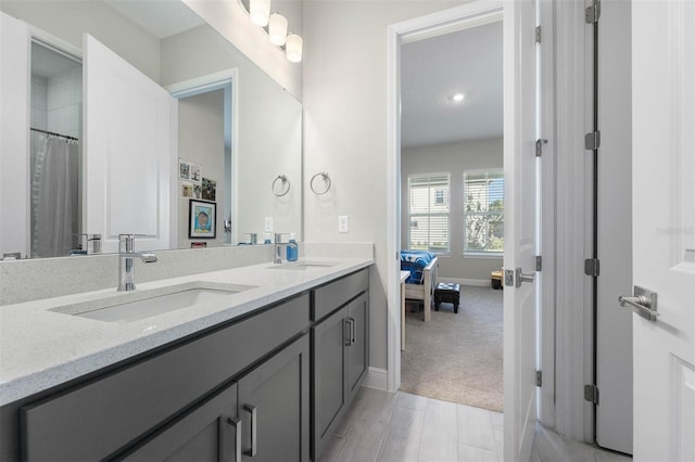 bathroom featuring hardwood / wood-style floors and vanity