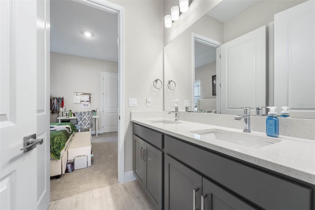 bathroom featuring hardwood / wood-style floors and vanity