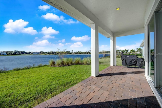 view of patio / terrace with a water view