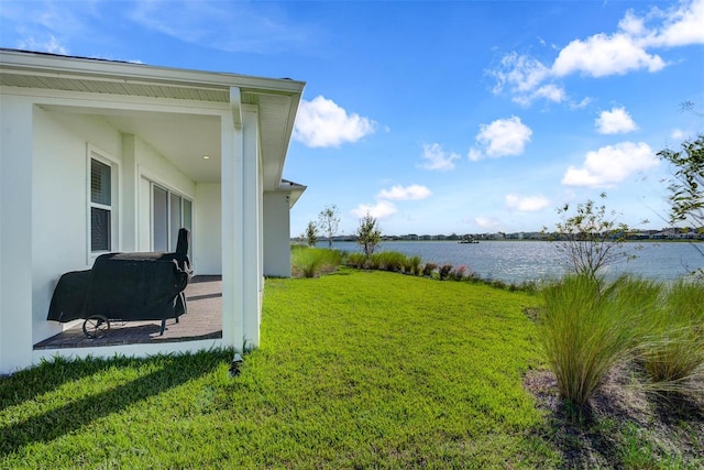 view of yard with a water view