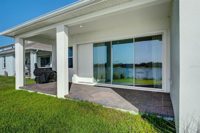 rear view of house with a patio area and a yard