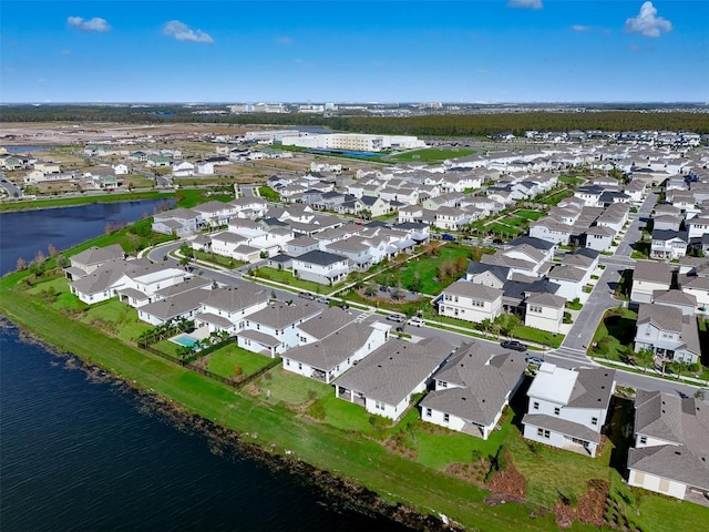 drone / aerial view with a water view