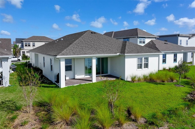 rear view of house with a yard