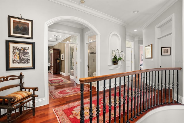 corridor with crown molding and dark hardwood / wood-style flooring