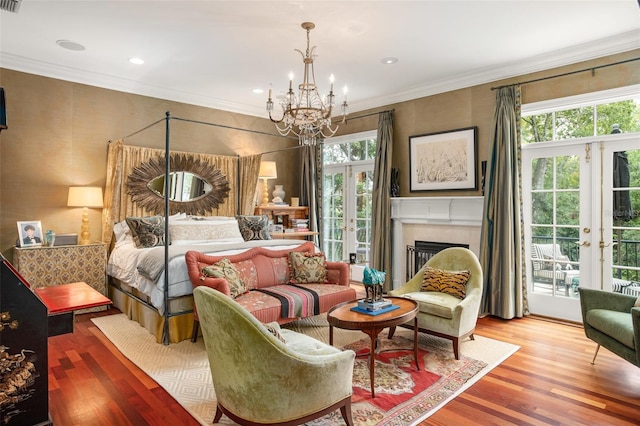 bedroom with light hardwood / wood-style flooring, multiple windows, access to exterior, and french doors