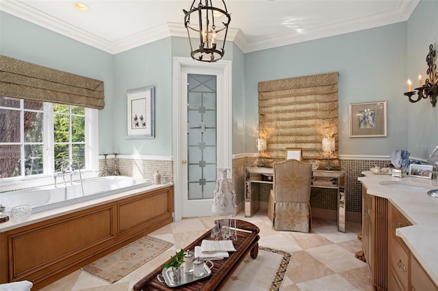 bathroom featuring tile walls, a notable chandelier, a tub to relax in, ornamental molding, and vanity