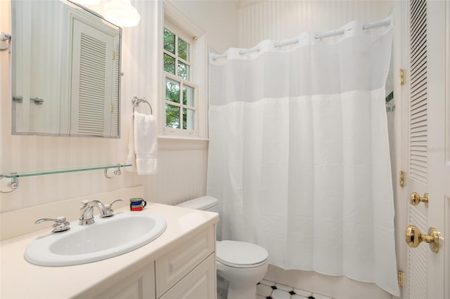 bathroom featuring vanity and toilet