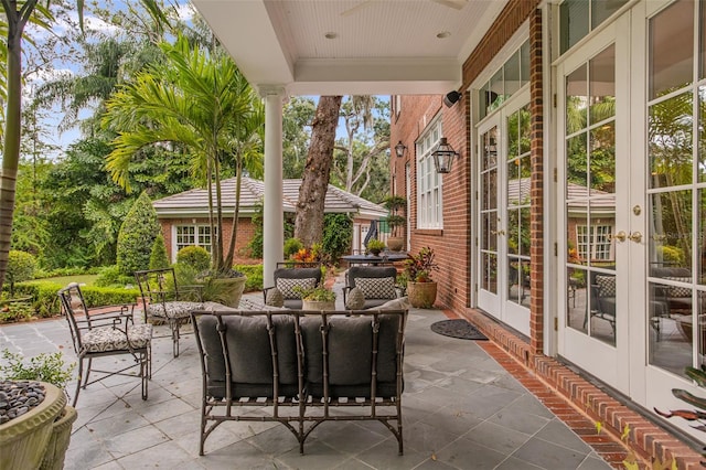 view of patio with an outdoor living space and french doors