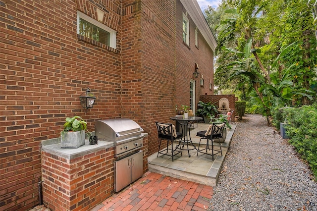 view of patio / terrace with area for grilling and an outdoor kitchen