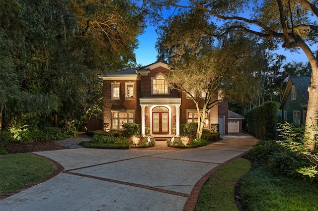 view of front of house with a balcony and a garage