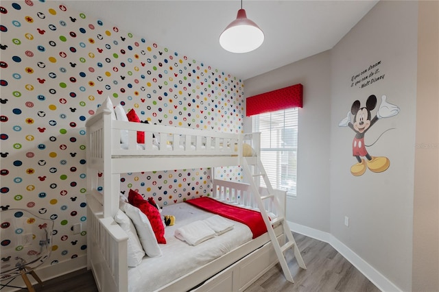 bedroom with hardwood / wood-style floors