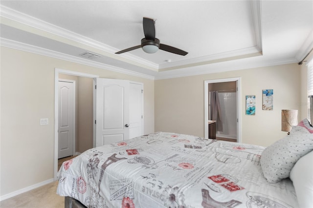 bedroom featuring a raised ceiling, crown molding, ceiling fan, and light carpet