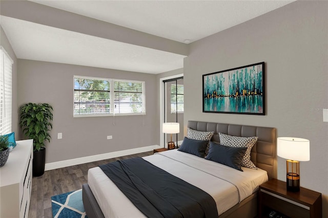 bedroom featuring dark hardwood / wood-style flooring