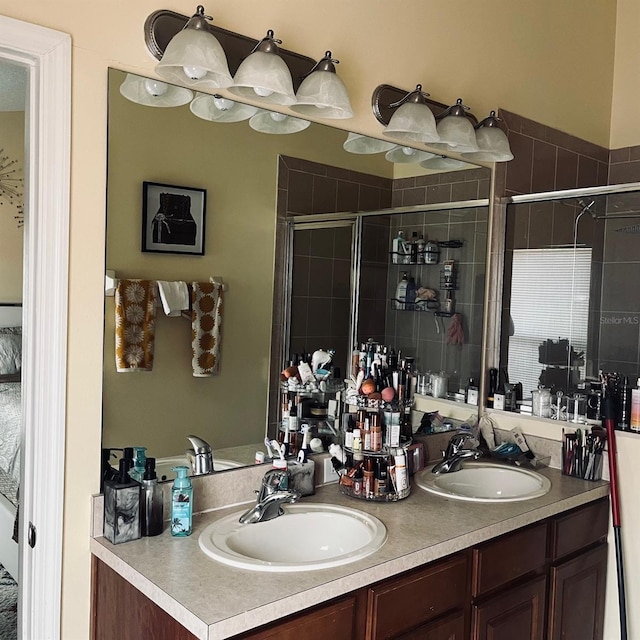 bathroom featuring vanity and an enclosed shower