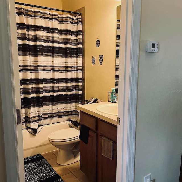 full bathroom with tile patterned flooring, vanity, toilet, and shower / bath combination with curtain