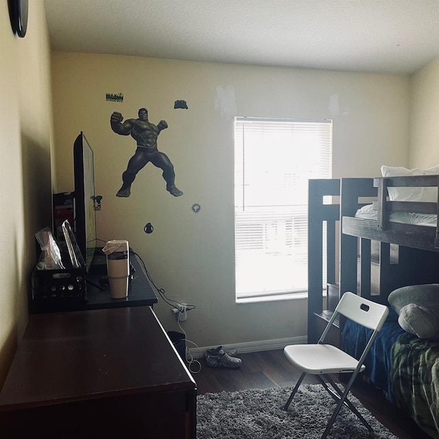 bedroom with wood-type flooring