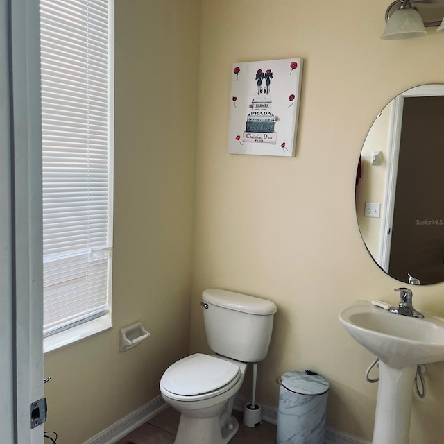 bathroom featuring tile patterned floors and toilet