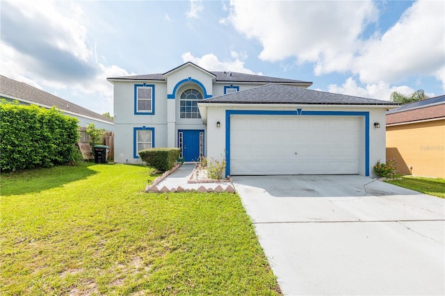 view of front of property featuring a front lawn and a garage