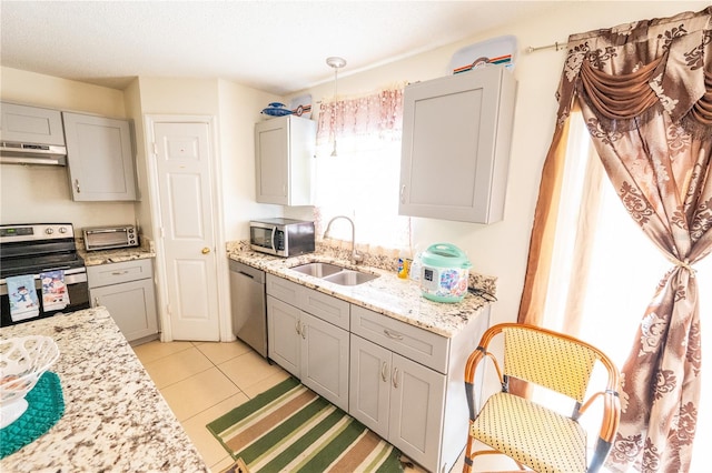 kitchen featuring appliances with stainless steel finishes, extractor fan, sink, and gray cabinets