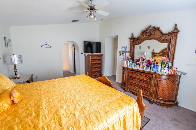 carpeted bedroom featuring lofted ceiling and ceiling fan