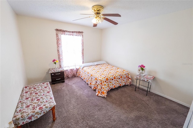 carpeted bedroom featuring a textured ceiling and ceiling fan