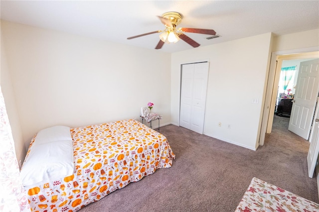 carpeted bedroom with a closet and ceiling fan